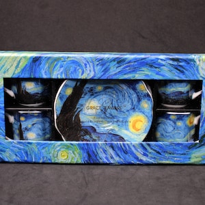 May include: A boxed set of four porcelain espresso cups and saucers featuring a blue, yellow, and green swirling post-impressionist art pattern. The box displays the text Grace Teaware, Fine Porcelain, Set of 4 Espresso Cups and Saucers.