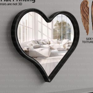 May include: A black heart-shaped mirror with a reflective surface, mounted on a grey wall. The mirror reflects a living room scene. To the right, a wooden wing-shaped mirror is displayed, with the text "SIDE VIEW & TEXTURE DETAIL". The text "2D Flat Printing" is visible.