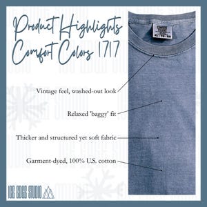 May include: A close-up of a blue Comfort Colors t-shirt. The shirt has a vintage, washed-out look and a relaxed fit. The fabric is thicker, structured, and soft, made from garment-dyed 100% U.S. cotton. The tag reads XL-TG-EG.