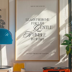 May include: A framed print with a white background and black text. The text reads "Take my yoke upon you. Learn from me for I am gentle and humble in heart. You shall find rest for your souls."