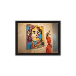 May include: A framed canvas print of a colorful portrait of a woman's face. A person in an orange dress stands to the right, gazing at the artwork. The painting features bold strokes of yellow, blue, and red.