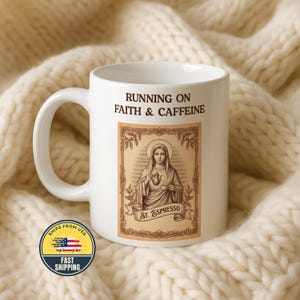May include: White ceramic mug with the text "RUNNING ON FAITH & CAFFEINE". The mug features an illustration of a saint holding a heart and a coffee pot, with the words "St. Espresso" below. A "Ships from USA" sticker is visible.