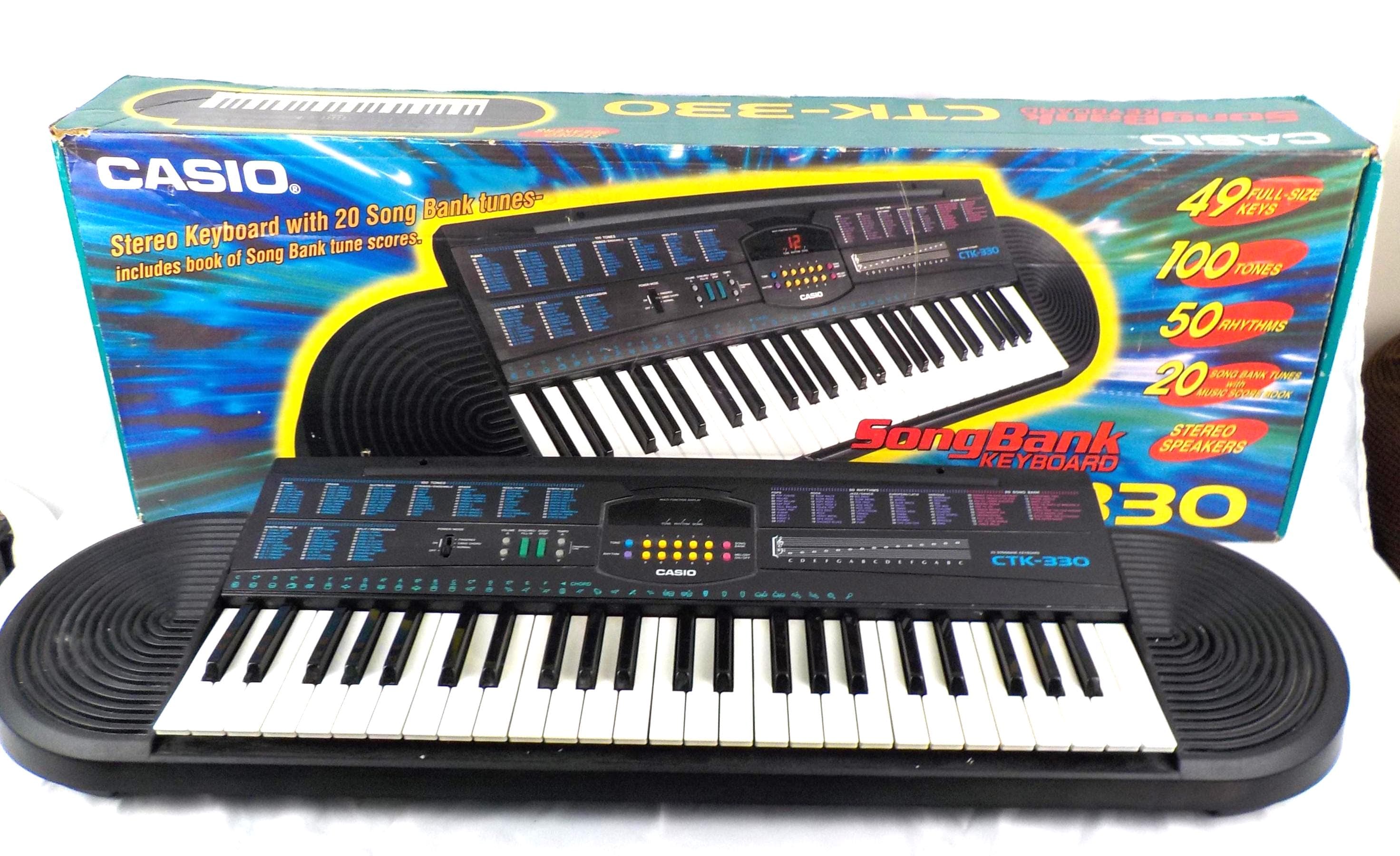 Casio CTK-330 49-key Keyboard Piano 100 Tones 50 Rhythms + Adapter