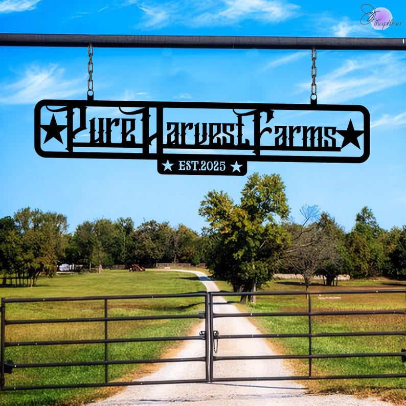 May include: Black metal sign with the text "Pure Harvest Farms" and "EST. 2025" hanging from a metal bar above a black metal gate.