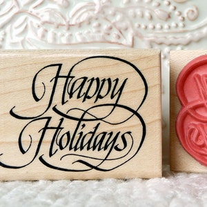 Timbro in gomma con scritta calligrafica Happy Holidays di oldislandstamps