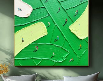 May include: Abstract oil painting on canvas featuring a vibrant green landscape with textured brushstrokes. Small figures are scattered across the scene, suggesting a ski slope or similar outdoor activity. The artwork is framed and displayed above a white sofa.