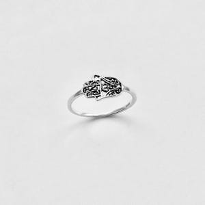 May include: A silver ring with a Hamsa hand design. The ring has a slender band and a detailed hand motif with intricate patterns. The ring is set against a white backdrop, emphasizing its design.
