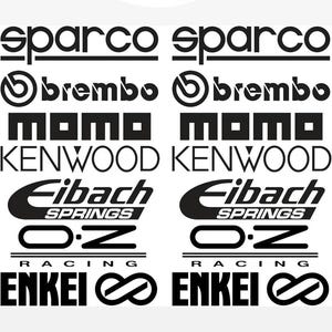 Può includere: L'immagine presenta il logo "amaf shop" sopra una serie di loghi in bianco e nero, tra cui "sparco", "brembo", "momo", "KENWOOD", "Eibach Springs", "O.Z Racing" e "ENKEI Racing".