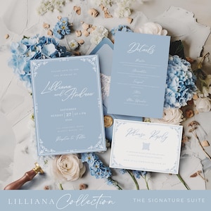 May include: A wedding invitation suite featuring a light blue color scheme with floral accents. The suite includes an invitation, details card, and RSVP card. The invitation reads "Lilliana and Andrew" with the wedding date and time. The suite is surrounded by blue and white flowers.