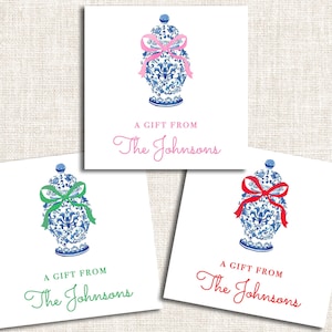 May include: Gift tags with a blue and white decorative vase design, each adorned with a bow in pink, green, or red. The text "A GIFT FROM The Johnsons" is printed below the vase on a white square.
