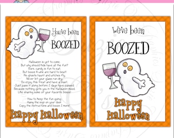 May include: Two Halloween-themed signs with orange borders. One says "You've been BOOZED" with a ghost holding a wine glass. The other says "We've been BOOZED" with a similar ghost. Both say "Happy Halloween".