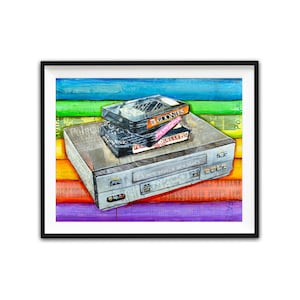 May include: A vintage VHS player with a stack of VHS tapes on top. The tapes are labeled "The Goonies", "Duelles", and "A new year, a new story". The player and tapes are on a colorful background of rainbow stripes.