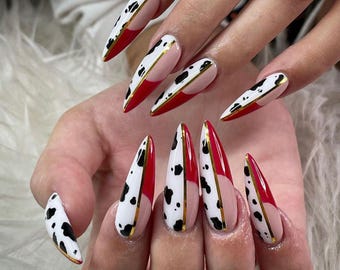 Bold Red Cow Print Stiletto Nails | Trendy Gold Line Nail Art Design