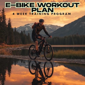 May include: An e-bike rider on a black mountain bike is reflected in the water. The image features the text "E-BIKE WORKOUT PLAN 4 WEEK TRAINING PROGRAM" in a yellow and black font. The background includes a lake, mountains, and a sunset.