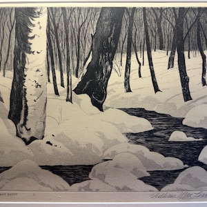 May include: A black and white print depicting a winter forest scene with a dark stream flowing through snow-covered ground. Large tree trunks stand in the foreground, with a dense thicket of bare trees in the background. The text "SUGAR BUSH" and "William MacLean" are printed at the bottom.