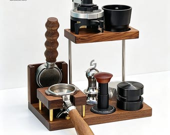 May include: A wooden espresso station featuring a two-tier stand with a portafilter holder, a metal tamper, a black distribution tool, and a silver puck screen. The set includes a dark wood base with gold accents and a matching wooden handle.