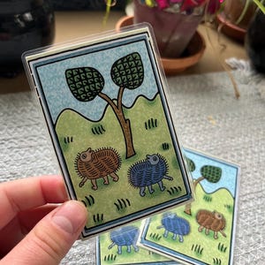 hand holding medieval themed laminated card
