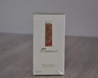 May include: A white box with a red and gold design. The box contains a bottle of Murano Eau de Parfum. The box reads "Eau de Parfum" and "50 ml e".