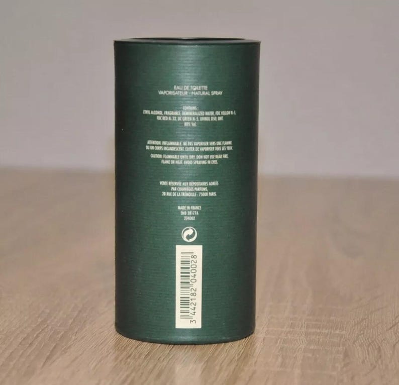 May include: A green cardboard tube with white text that reads "Eau de Toilette Vaporisateur - Natural Spray". The tube also includes the ingredients, warnings, and a barcode.