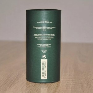May include: A green cardboard tube with white text that reads "Eau de Toilette Vaporisateur - Natural Spray". The tube also includes the ingredients, warnings, and a barcode.