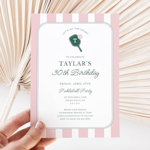 May include: Pink and white striped invitation with a green pickleball paddle graphic. The invitation is for Taylar's 30th birthday pickleball party. The party will be held on Friday, April 27th at 125 Pickleball Lane, Indian Wells, CA 45789. The invitation requests guests to bring their paddle, as the tournament begins at 10am, followed by lunch and cocktails. RSVP to Anna at 123 456 7890.