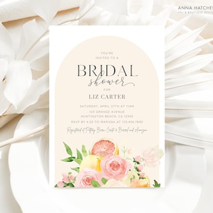 May include: A peach-coloured bridal shower invitation with a watercolour illustration of lemons, oranges, and pink roses. The text reads "You're invited to a Bridal Shower for Liz Carter. Saturday, April 27th at 11am, 123 Orange Avenue, Huntington Beach, CA 12345. RSVP by 4:20 to Marissa at 123.456.7890. Registered at Pottery Barn Crate & Barrel and Amazon."