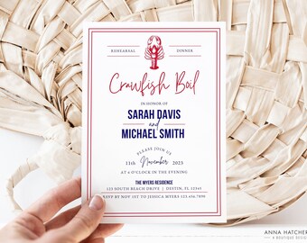 May include: A white invitation card with red and blue trim. The card features a red crawfish illustration and the text "Crawfish Boil" in red cursive. The invitation is for a crawfish boil in honor of Sarah Davis and Michael Smith on November 11th, 2023 at the Myers Residence in Destin, Florida.