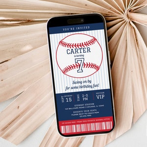 May include: A blue and white baseball-themed birthday invitation for a boy turning seven. The invitation is in the shape of a smartphone screen and features a baseball with the name "Carter" and the number "7" on it. The text "You're Invited" is at the top of the invitation, and the text "Swing on by for some birthday fun!" is below the baseball. The invitation also includes the date, time, and location of the party.