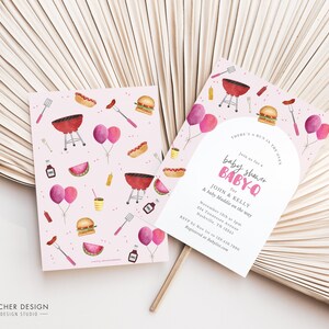 May include: Pink and white baby shower invitation with a barbecue theme. The invitation features a grill, hot dogs, hamburgers, watermelon, and balloons. The text on the invitation reads "Join us for a baby shower BABY-Q for JOHN & KELLY & baby Maddie on the way".