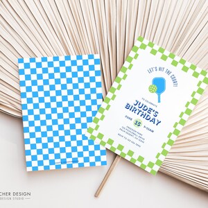 May include: A green and white checkered invitation with a blue paddle and ball graphic. The text reads "Let's hit the court! To celebrate Jude's Birthday June 15th 2-5pm Freedom Park 123 Pickleball Drive Palm Desert, CA 92260 RSVP to 123.456.7890"