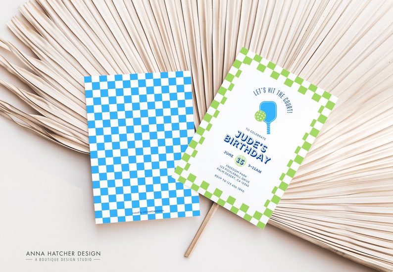 May include: A green and white checkered invitation with a blue paddle and ball graphic. The text reads "Let's hit the court! To celebrate Jude's Birthday June 15th 2-5pm Freedom Park 123 Pickleball Drive Palm Desert, CA 92260 RSVP to 123.456.7890"