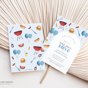 May include: Blue and white baby shower invitation with a watercolour illustration of a grill, hot dogs, hamburgers, watermelon, and balloons. The text reads "There's a bun in the oven. Join us for a baby shower BABY-Q for John & Kelly and baby Charles on the way. November 12th at 3pm. 234 Frances Avenue Nashville, TN 32841. RSVP by Nov 1st to (123) 456 7890. Registered at Babylist.com"
