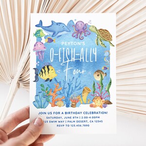 May include: A blue and white birthday invitation with a watercolor illustration of a variety of sea creatures, including a dolphin, octopus, turtle, jellyfish, and fish. The text reads "Peyton's O-Fish-Ally Four".