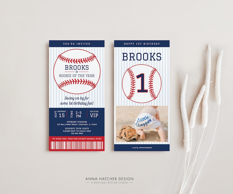 May include: Baseball-themed first birthday party invitation with a blue and red baseball graphic and the text "Brooks is Rookie of the Year". The invitation also includes a photo of a baby wearing a baseball cap and a onesie that says "Little Slugger".
