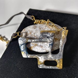 Three-Dimensional Art: Epoxy Geometric Necklace.Grey, gold and with leather cord necklace.