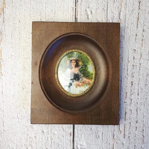Vintage wall-mounted wooden and brass frame, hand-painted, antique convex glass, painting of a woman and flowers, signed artisan painting