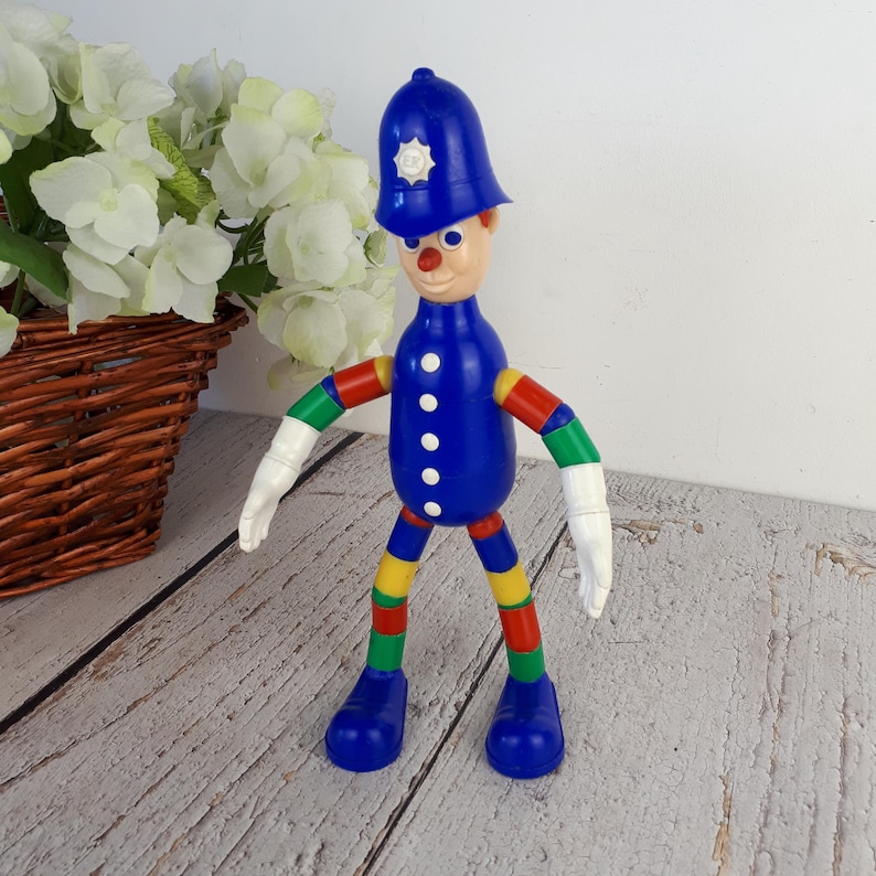 Vintage plastic toy, police officer figurine, MERIT Safe-Play Nursery Toy brand, toy with bendable arms and legs, made in England, 1960s image 1