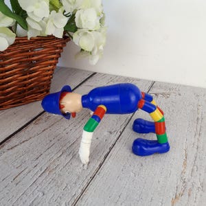 Vintage plastic toy, police officer figurine, MERIT Safe-Play Nursery Toy brand, toy with bendable arms and legs, made in England, 1960s image 4