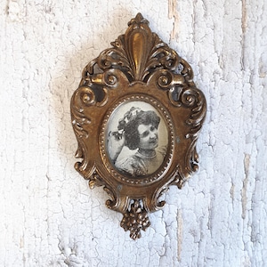 Vintage gold-tone metal and glass photo frame, antique hanging frame, richly chiseled decoration, wall decoration, Art Deco France, unique gift