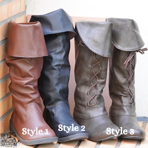 May include: Three styles of knee-high boots with different designs. The first boot is brown leather with a fold-over top. The second boot is black leather with a fold-over top. The third boot is brown leather with a lace-up design.
