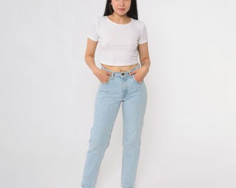 Jeansy Levi's 550 z lat 90., jasnoniebieskie, z wysokim stanem, luźny krój, zwężane nogawki, bawełniane, jeansy typu mom jeans, grunge, streetwear, vintage, bardzo małe, rozmiar XS 3