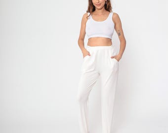 Pantalones con estribo color crema, años 80 y 90, pantalones cónicos de cintura alta, pantalones ajustados de pierna estrecha de los años 80, pantalones vintage preppy medianos M