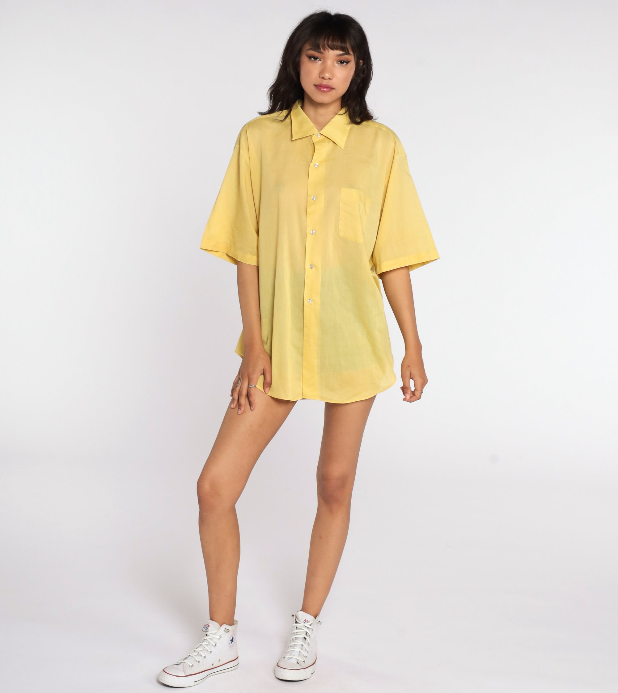 yellow button up shirt