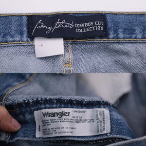 May include: A close-up of a blue denim Wrangler jeans label with the text "Wrangler 13MGSHD 35 X 34" and care instructions. The label also states "Made in Mexico of US Fabric 100% Cotton Exclusive of Decoration."