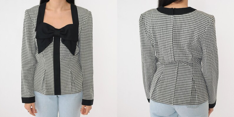 May include: A black and white gingham patterned blouse with a black bow at the neckline. The blouse has long sleeves and a fitted silhouette.