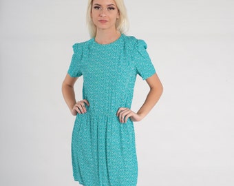 beige textured dress S 7-10 Color:Forever Blue Its neutral beige tone 60 Tory Burch Embroidered