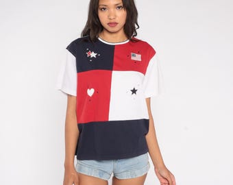 Camiseta con la bandera estadounidense de los años 90, color rojo, blanco y azul, con bloques de colores patrióticos de EE. UU., apliques con detalle de corazón y estrella, estilo americano cosido, 4 de julio, talla grande L