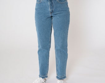 May include: A pair of light blue denim jeans with a high waist and a straight leg fit. The jeans have a frayed hem and are made of a soft, comfortable fabric.