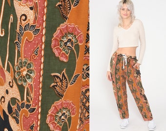 Pantalon ample à fleurs en batik des années 90, pantalon fuselé décontracté orange brûlé, rayé vert taille haute, pantalon à fleurs vintage petit moyen
