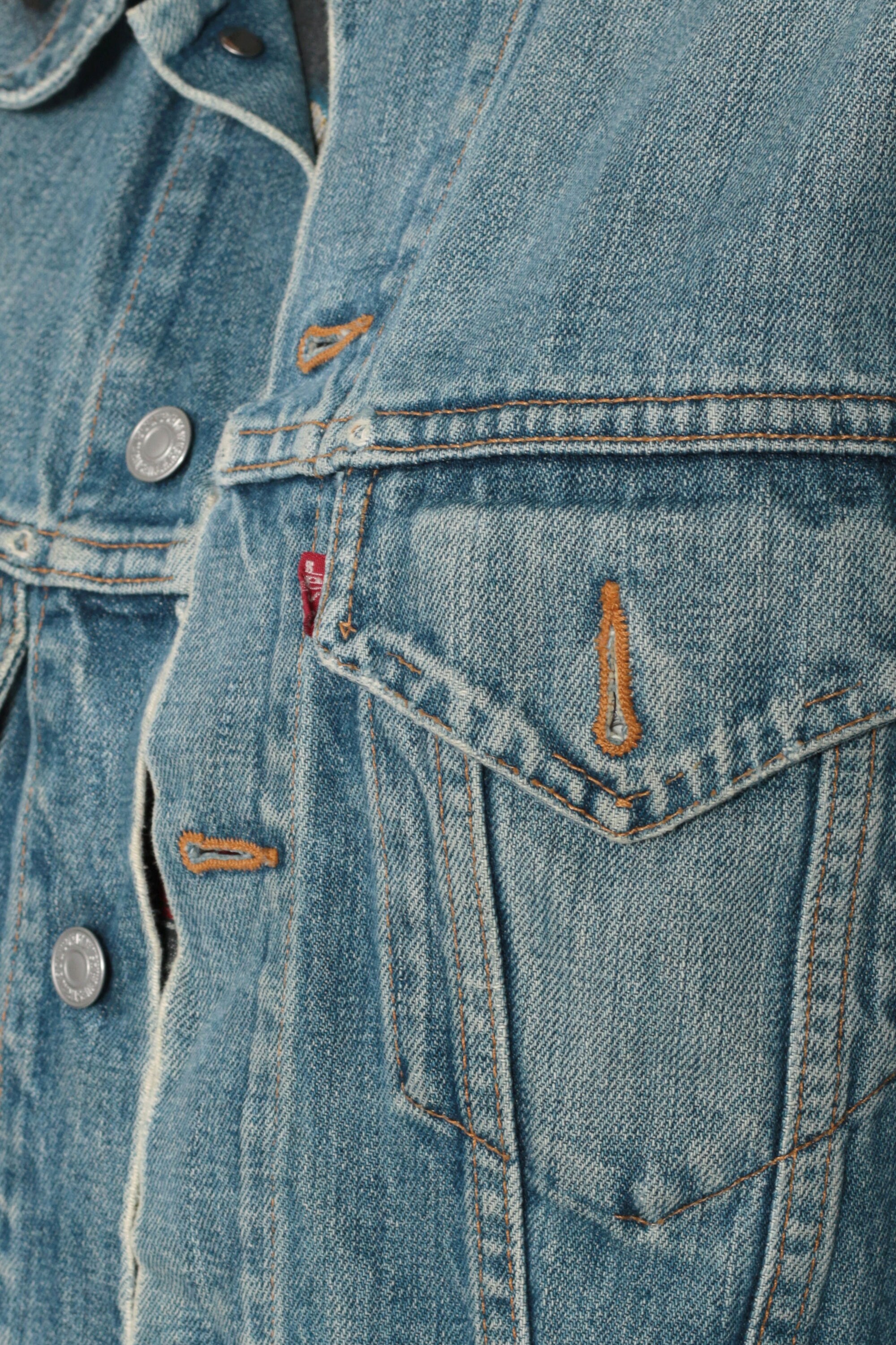 jean with red stripe